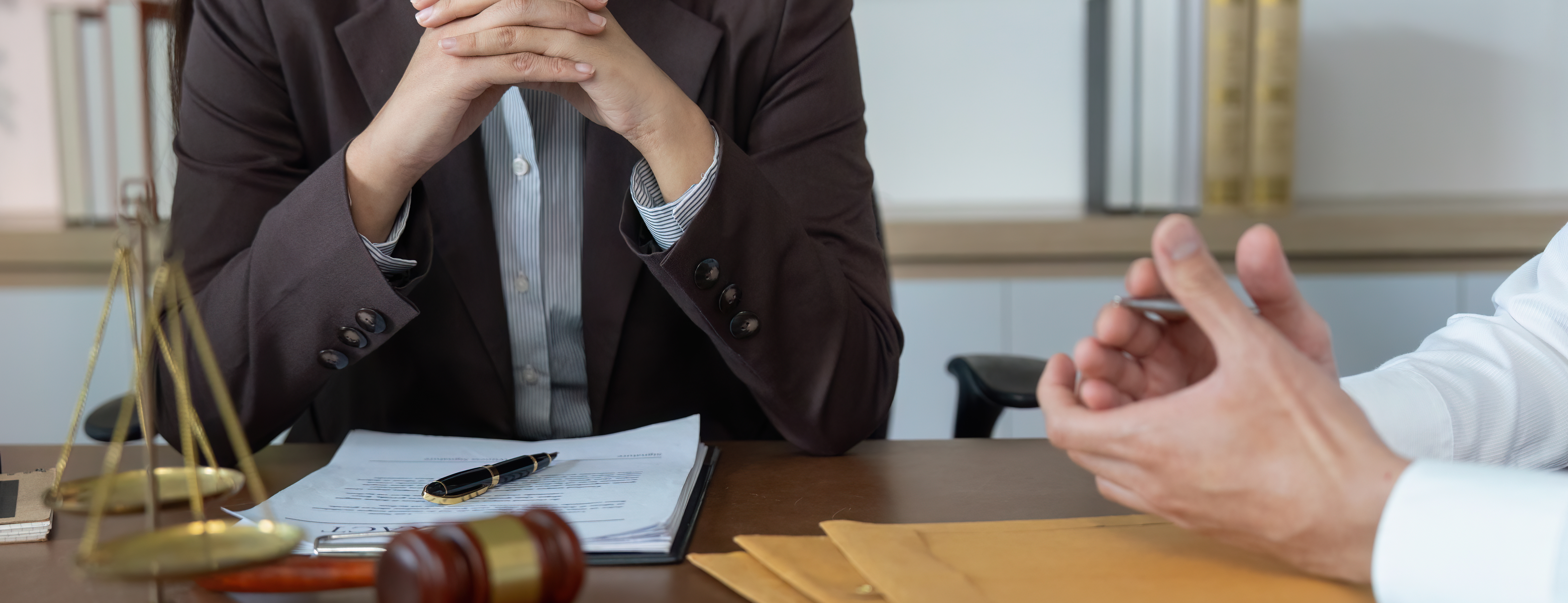 Professional Lawyer Meeting. Client listening attentively during legal consultation.